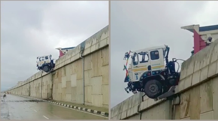 बारिश में बेकाबू हुआ गिट्टी लदा ट्रक, फोरलेन की रेलिंग से टकराया; इंजन हवा में लटका